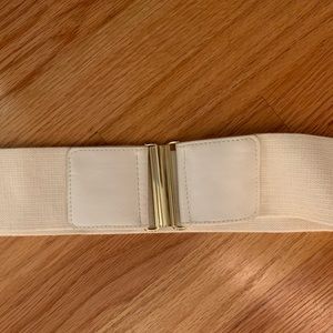 cream elastic belt with gold buckle